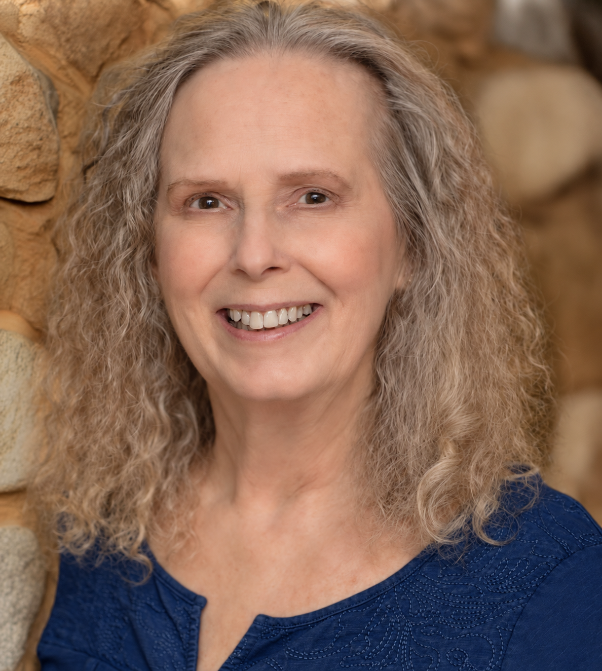 Author Gretchen Jeannette in a dark navy blue shirt